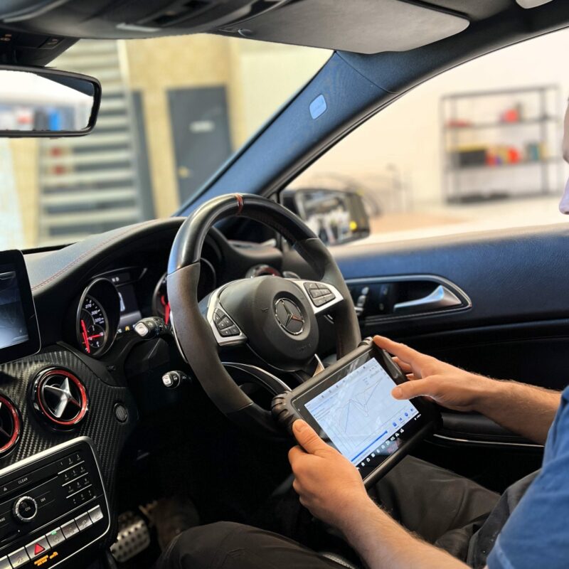 Internal shot of Mercedes service Perth expert performing diagnostics