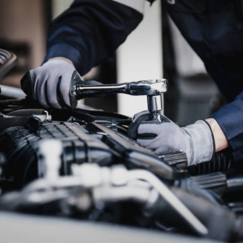 Porsche service Perth mechanic working on a car engine